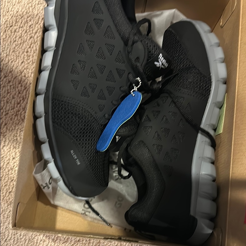 Reebok Black and Gray Athletic Shoes with Modern Design
